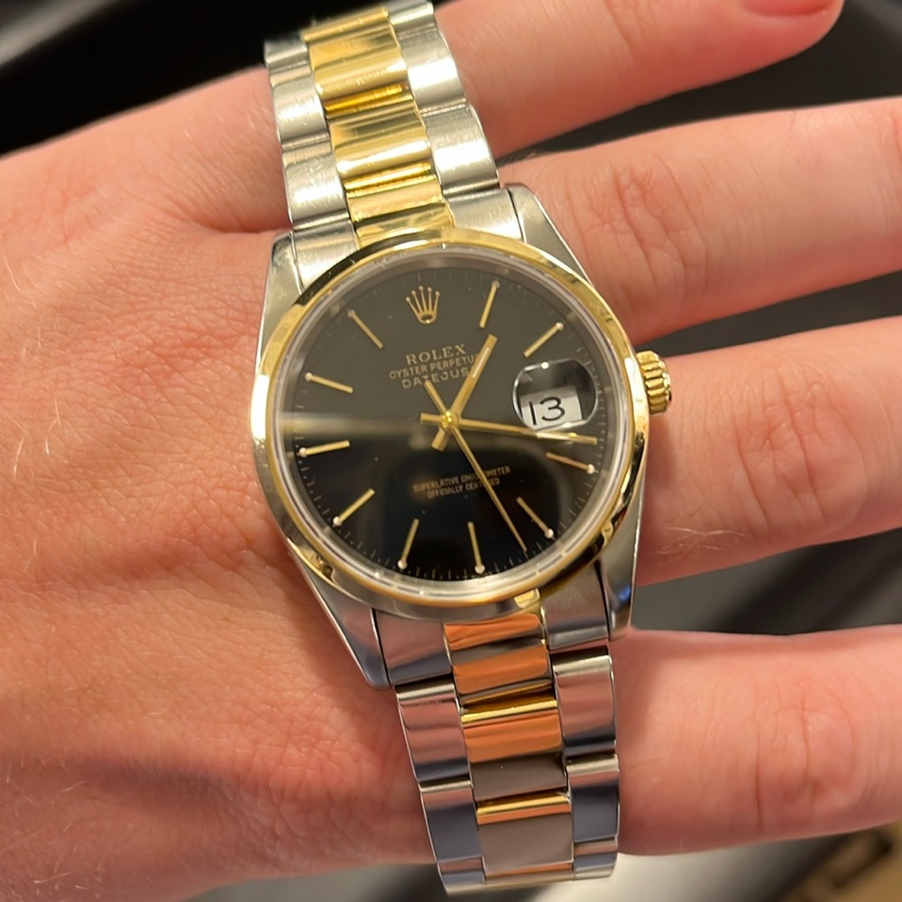Rolex oyster perpetual datejust 34mm gold & stainless steel band. black face.